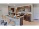 Open kitchen featuring granite countertops, a breakfast bar with seating and stainless steel appliances at 2940 Ne 21St Terrace Rd, Ocala, FL 34470