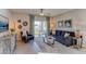 Comfortable living room featuring stylish decor, a plush sofa, and access to an outdoor patio at 2940 Ne 21St Terrace Rd, Ocala, FL 34470