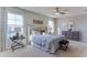 Serene main bedroom with tufted headboard, soft lighting, and water view promotes relaxation at 2940 Ne 21St Terrace Rd, Ocala, FL 34470