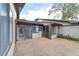 Back patio with sliding glass doors at 3616 Ne 17Th Ln, Ocala, FL 34470
