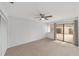 Neutral bedroom with a sliding glass door and closet at 3616 Ne 17Th Ln, Ocala, FL 34470