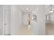 Bright entryway with tiled floor and modern fixtures leading into an open living space at 3616 Ne 17Th Ln, Ocala, FL 34470