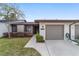Front exterior view of the home featuring a well-manicured lawn and attached garage at 3616 Ne 17Th Ln, Ocala, FL 34470