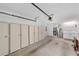 Garage with storage cabinets, washer, dryer and access door at 3616 Ne 17Th Ln, Ocala, FL 34470