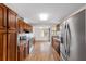 Open kitchen with stainless steel appliances, granite countertops, wood cabinets, and a breakfast nook at 3616 Ne 17Th Ln, Ocala, FL 34470