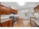 Traditional style kitchen featuring wood cabinets and laminate countertops at 3616 Ne 17Th Ln, Ocala, FL 34470