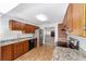 Well-equipped kitchen with stainless steel appliances and wood cabinets at 3616 Ne 17Th Ln, Ocala, FL 34470