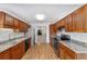 Fully equipped kitchen featuring wood cabinets and stainless steel appliances at 3616 Ne 17Th Ln, Ocala, FL 34470