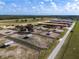 Equestrian property with paddocks, shelters, and horse-care facilities, set against the backdrop of a picturesque landscape at 4695 Ne 112Th Ln, Anthony, FL 32617