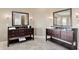 Elegant bathroom featuring dual vanities, large mirrors, and designer lighting fixtures at 4695 Ne 112Th Ln, Anthony, FL 32617