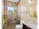 Bathroom featuring a tiled glass shower enclosure and granite vanity at 4695 Ne 112Th Ln, Anthony, FL 32617