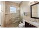 Elegant bathroom showcasing a glass shower and granite countertop with a dark wood vanity at 4695 Ne 112Th Ln, Anthony, FL 32617