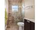 Bathroom featuring a tiled glass shower enclosure and granite vanity at 4695 Ne 112Th Ln, Anthony, FL 32617