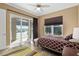 Spacious bedroom with sliding glass doors to the screened pool and patio area at 4695 Ne 112Th Ln, Anthony, FL 32617