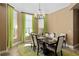 Formal dining room featuring ample natural light and a stylish chandelier at 4695 Ne 112Th Ln, Anthony, FL 32617