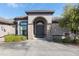 Stunning home featuring a grand entrance with stone accents and arched doorway at 4695 Ne 112Th Ln, Anthony, FL 32617