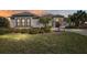 Home exterior with manicured lawn, stone accents, and a decorative horse statue at 4695 Ne 112Th Ln, Anthony, FL 32617
