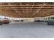 Spacious garage area featuring open rafters and multiple work areas and parking spots at 4695 Ne 112Th Ln, Anthony, FL 32617