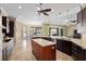 Open kitchen features stainless appliances, granite countertops and a spacious island at 4695 Ne 112Th Ln, Anthony, FL 32617