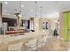 Expansive kitchen with bar seating, modern appliances, and rich wood cabinets, blending style with functionality at 4695 Ne 112Th Ln, Anthony, FL 32617
