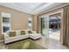 Inviting living room with tile floors, large windows, and sliding doors to the pool area at 4695 Ne 112Th Ln, Anthony, FL 32617