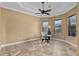 Bright office space featuring tile floors, ample natural light, and a modern desk setup at 4695 Ne 112Th Ln, Anthony, FL 32617