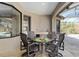 Outdoor dining area featuring built-in kitchen and travertine floors, adjacent to pool at 4695 Ne 112Th Ln, Anthony, FL 32617