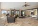 Spacious covered patio with comfortable seating, ceiling fans, and views of the surrounding landscape at 4695 Ne 112Th Ln, Anthony, FL 32617