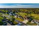 Aerial view of homes near a golf course, showcasing a community with lush greenery and well-manicured landscapes at 5115 Nw 21St Loop, Ocala, FL 34482