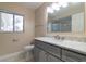 Bathroom vanity featuring granite countertops and a tiled floor at 5115 Nw 21St Loop, Ocala, FL 34482