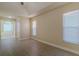 Spacious bedroom with wood floors and natural light from three windows at 5115 Nw 21St Loop, Ocala, FL 34482
