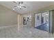 Open-concept living area with ceramic tile floors and sliding door access to the lanai at 5115 Nw 21St Loop, Ocala, FL 34482