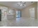 Open-concept area with ceramic tile floors and a sliding door leading to the backyard pool at 5115 Nw 21St Loop, Ocala, FL 34482