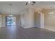 Open-concept living area with luxury vinyl plank flooring and sliding doors leading to an outdoor pool at 5115 Nw 21St Loop, Ocala, FL 34482