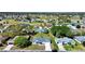 Sprawling community with manicured lawns, mature trees, and golf course views at 5347 Nw 20Th Pl, Ocala, FL 34482