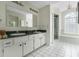 Bright bathroom featuring double sinks, a glass block window, and a separate shower and tub at 5347 Nw 20Th Pl, Ocala, FL 34482