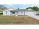 Welcoming single-story home with a neat front yard and attached garage at 5347 Nw 20Th Pl, Ocala, FL 34482