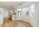 Bright kitchen features wood floors, modern appliances, and an eat-in nook with bay windows at 5347 Nw 20Th Pl, Ocala, FL 34482