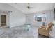 Bright living room with modern flooring, fan, and natural light at 5347 Nw 20Th Pl, Ocala, FL 34482