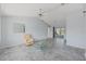 Living room with gray marble floors, a ceiling fan, and a view of the outdoor patio at 5347 Nw 20Th Pl, Ocala, FL 34482