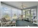 Relaxing sunroom with ceiling fan and views of the outdoors at 5347 Nw 20Th Pl, Ocala, FL 34482