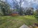 Spacious backyard with a shed and fenced perimeter, providing privacy and space for outdoor activities at 5520 Nw 57Th St, Ocala, FL 34482
