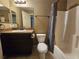 Functional bathroom featuring vanity, toilet, tub and shower with neutral tones providing a clean and inviting space at 5520 Nw 57Th St, Ocala, FL 34482