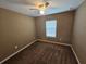 Neutral bedroom with a ceiling fan and a window that offers a calm and serene atmosphere at 5520 Nw 57Th St, Ocala, FL 34482