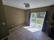 Bright dining area with tile flooring and a sliding glass door with backyard access at 5520 Nw 57Th St, Ocala, FL 34482