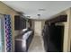 Clean kitchen with granite countertops, dark cabinetry and black appliances at 5520 Nw 57Th St, Ocala, FL 34482