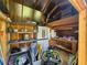 Organized storage shed interior with shelving, workbench, and ample space for tools and equipment at 5520 Nw 57Th St, Ocala, FL 34482