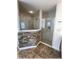 Elegant bathroom with glass shower, stone accent wall, and well-lit space offers a luxurious and modern bathing experience at 6307 Se 8Th Ln, Ocala, FL 34472