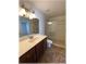 Bathroom featuring a single sink, vanity, and glass door shower with a clear door and tiled flooring at 6307 Se 8Th Ln, Ocala, FL 34472