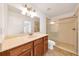 Well-lit bathroom with a large vanity, and a glass-enclosed shower, and neutral finishes at 6307 Se 8Th Ln, Ocala, FL 34472